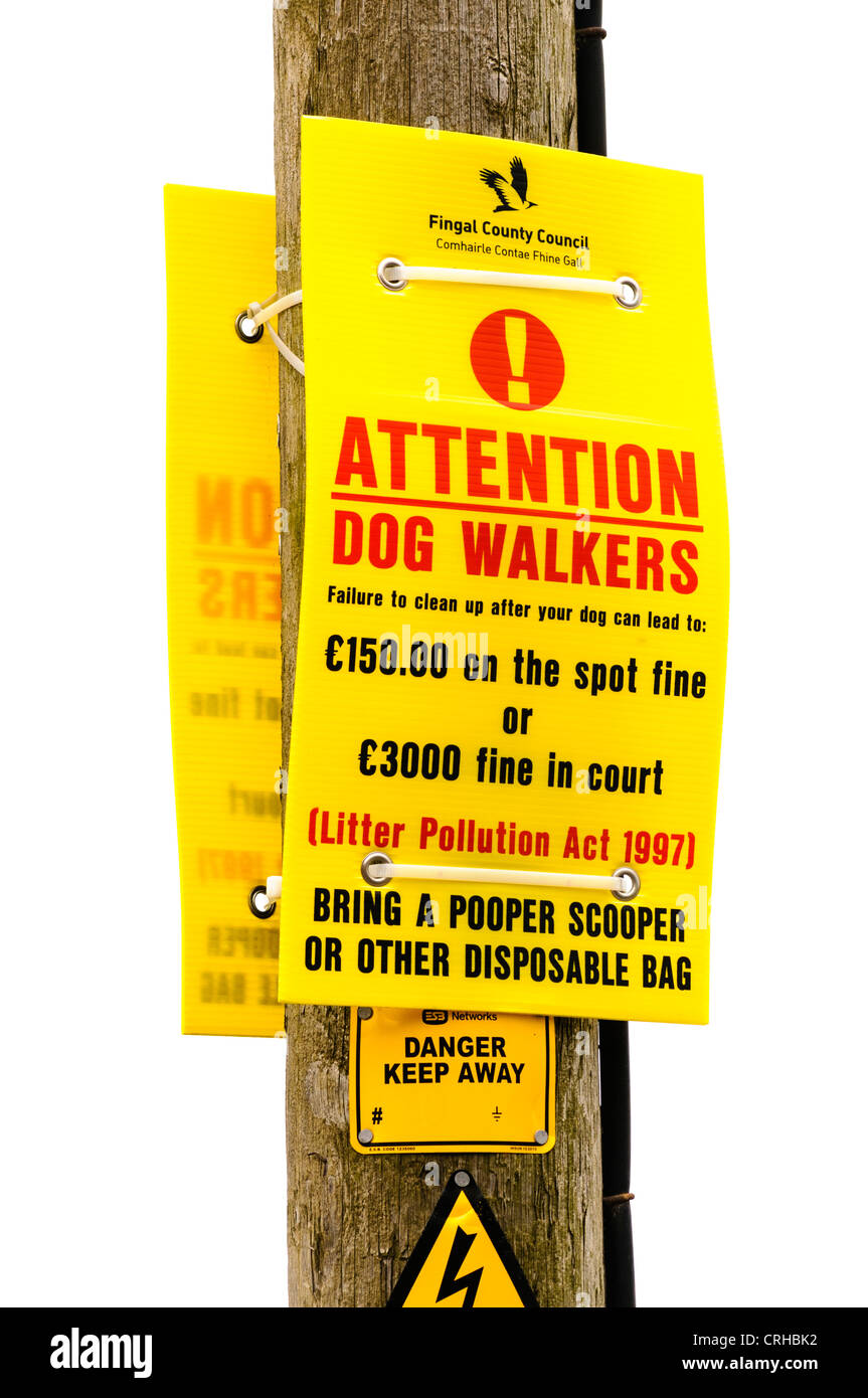 Sign warning dog owners to clear up after their dogs. Stock Photo