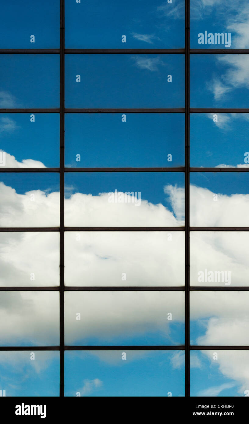 Blue sky and clouds reflected in Office block glass windows. London Stock Photo