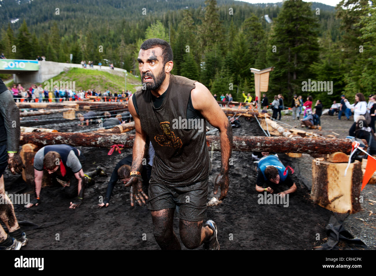 Participants in the 2012 Vancouver Tough Mudder event at the Whistler Olympic Park. Whistler BC, Canada. Stock Photo