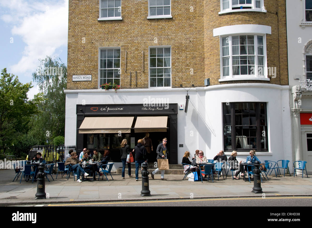 People eating outside ca'puccion cafe, Kings Road, Chelsea London