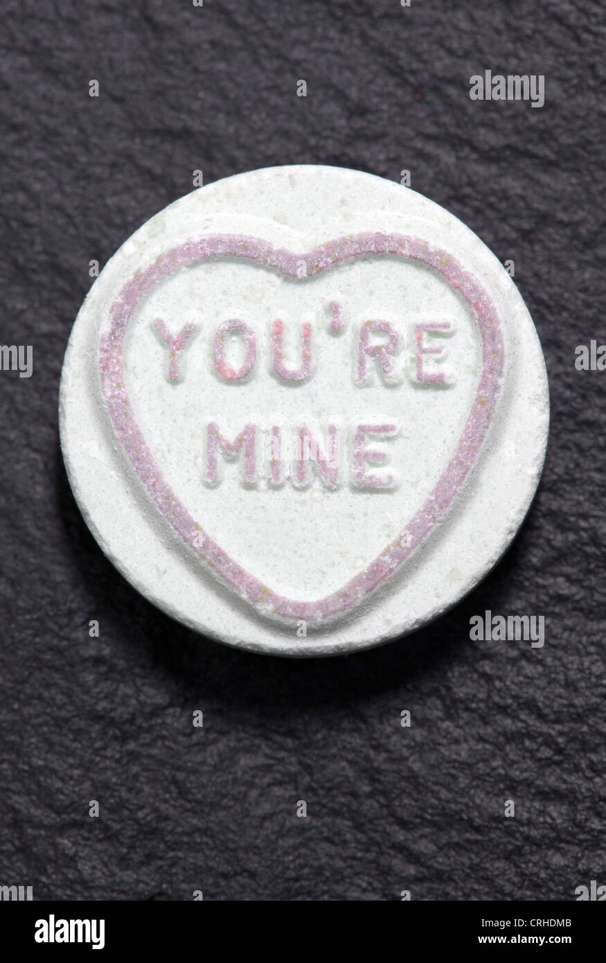 'you're mine' loveheart sweet on black background Stock Photo