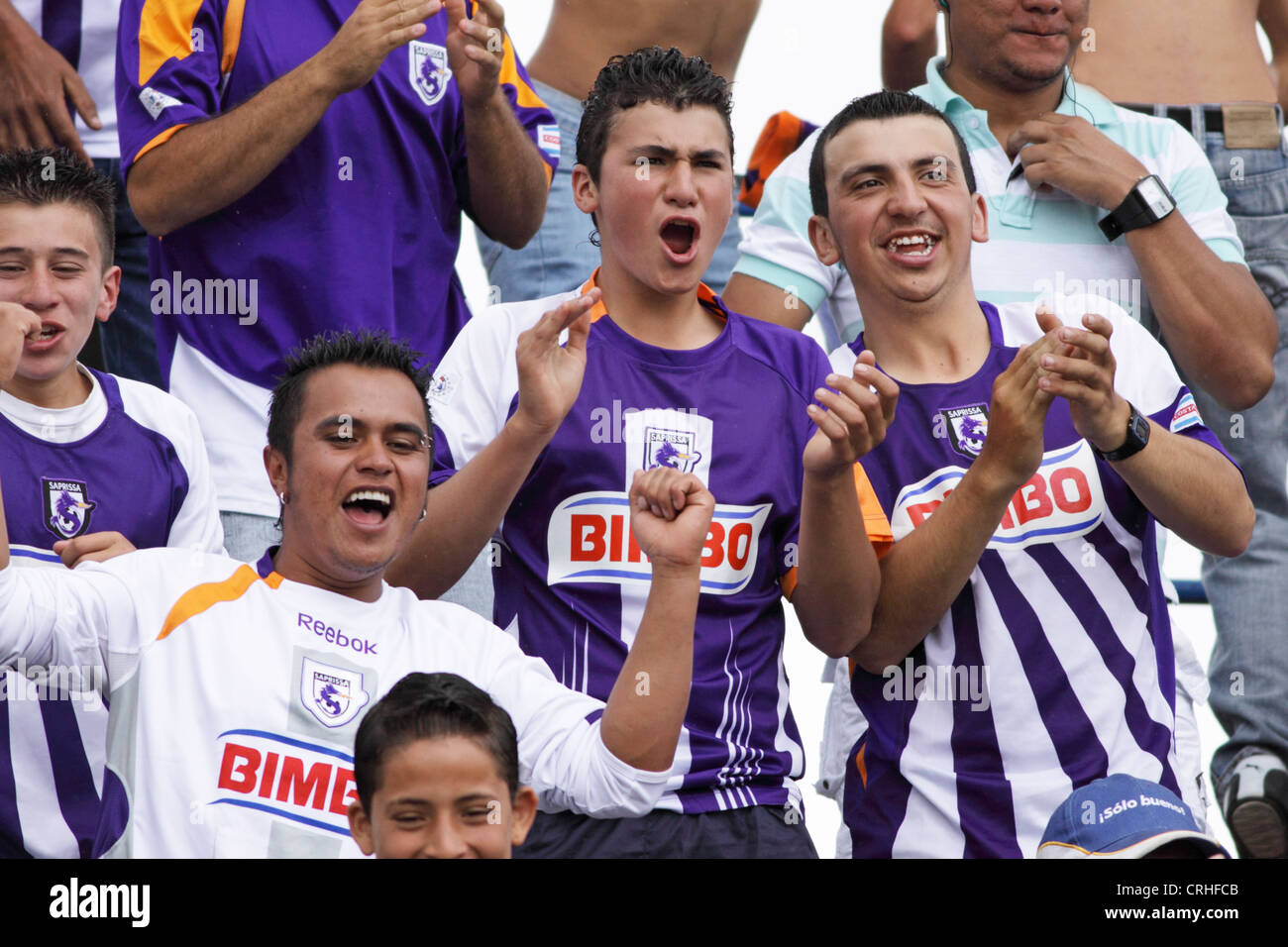 Football / soccer fans of club Saprissa in the stadium of Cartago, Costa Rica. Stock Photo
