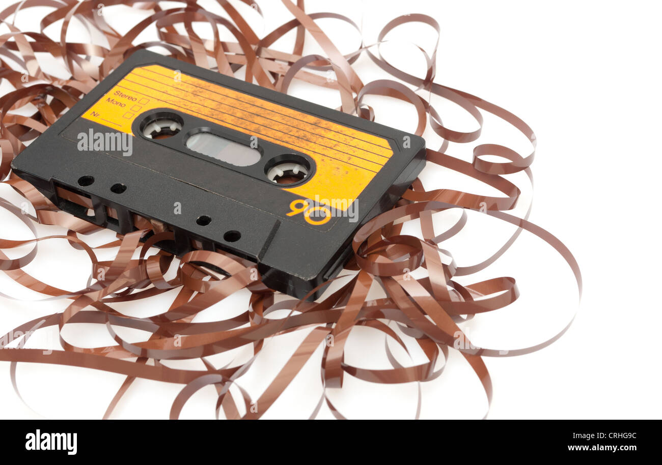 Retro Audio Cassette Tape With Pulled Out Tape on White Background
