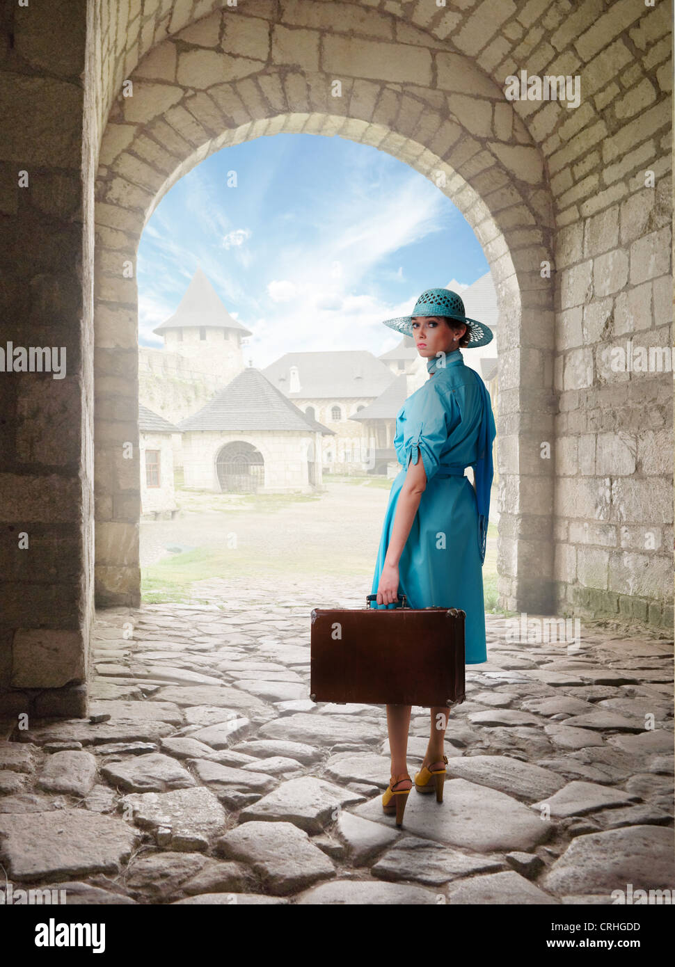 traveling woman in retro clothing.Collage with old castle as a background Stock Photo