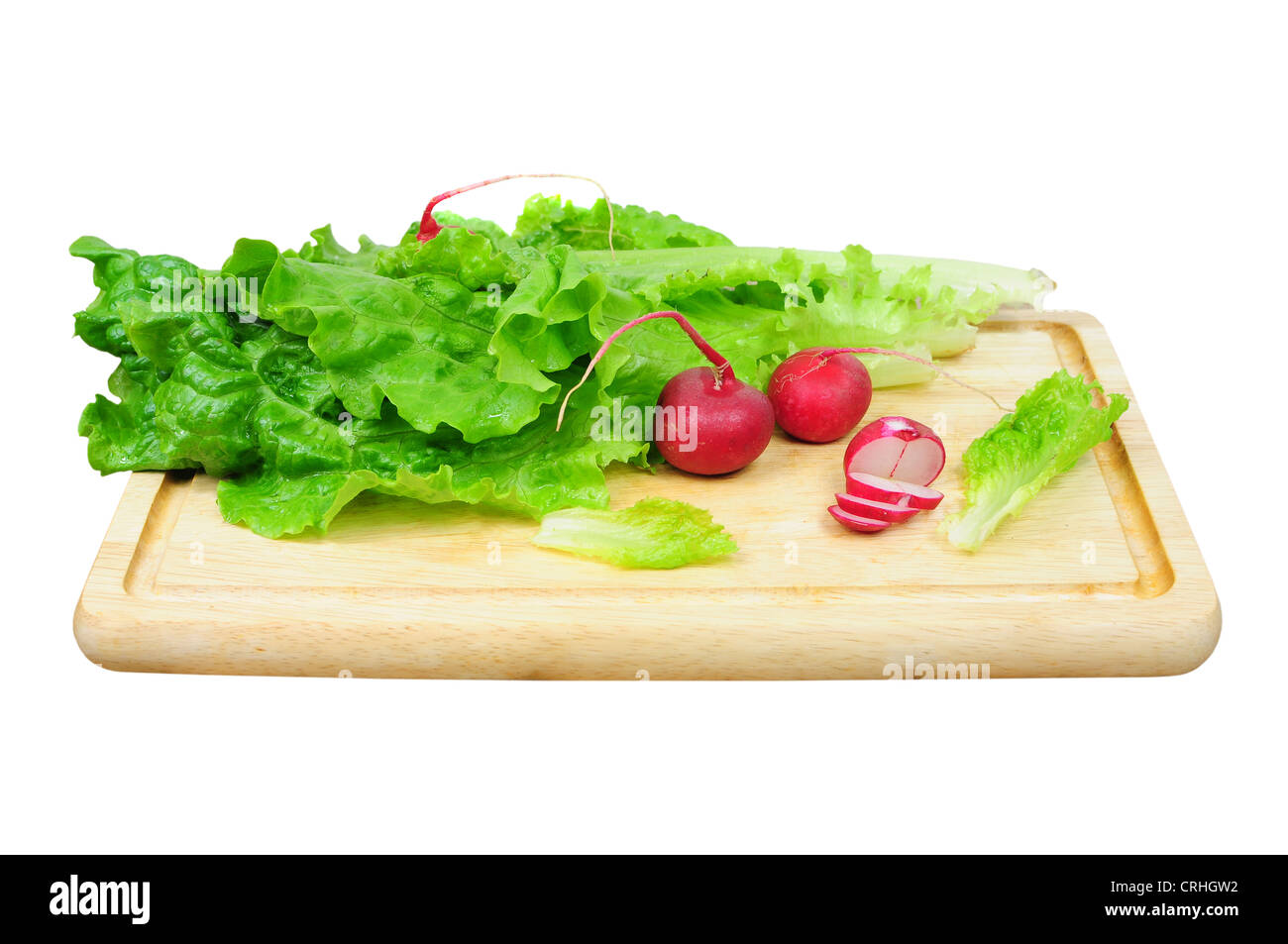 Raw pork steak and lettuce leaf on wooden board, isolated Stock Photo