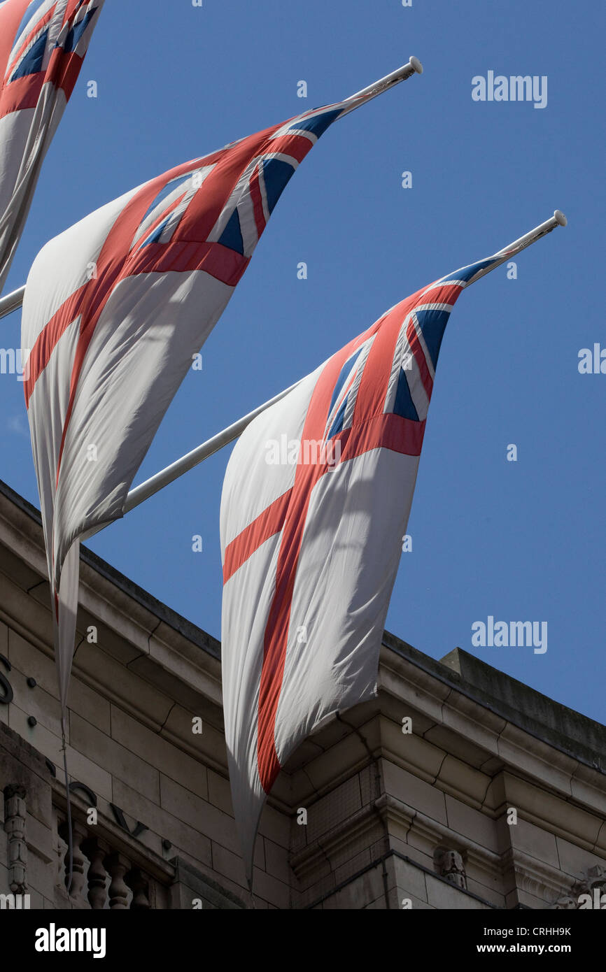White Ensign Royal Navy maritime flags flying from Admiralty Arch in