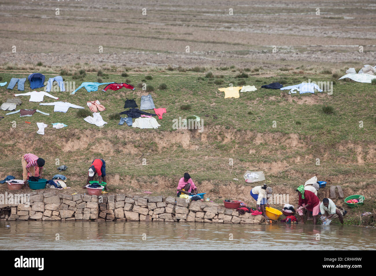 laundry drying on riverbank on the outskirts of Antananarivo, Madagascar Stock Photo