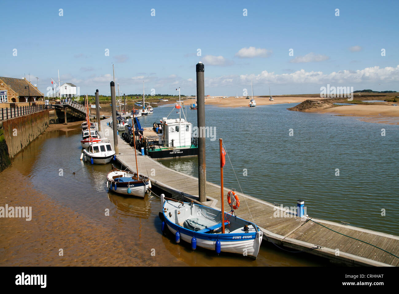 Boats at pontoon moorings The Harbour Wells next the Sea Norfolk England UK Stock Photo