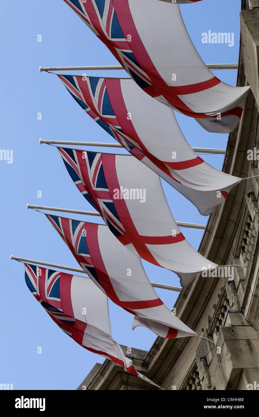 White Ensign Royal Navy maritime flags flying from Admiralty Arch in London Stock Photo