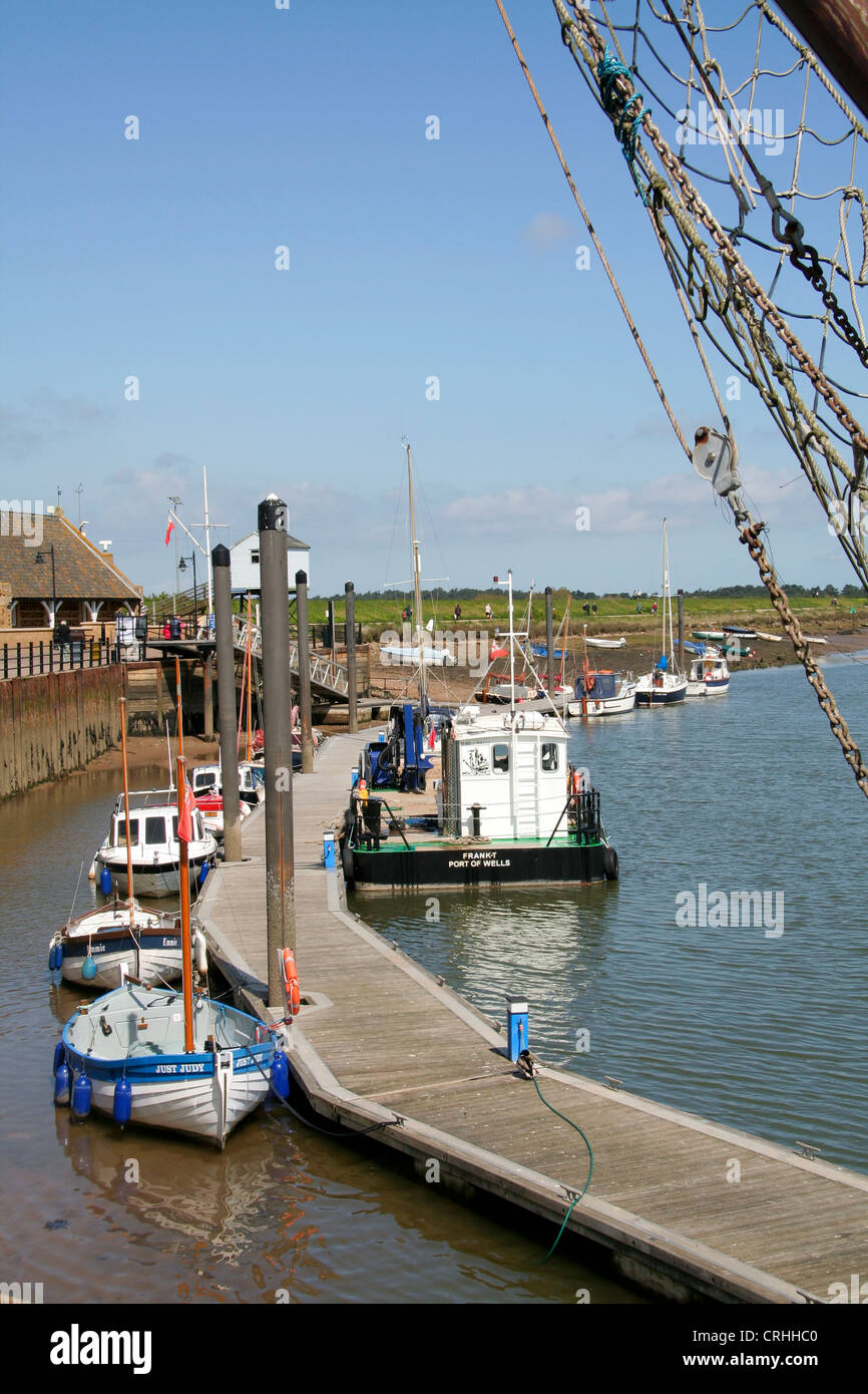 Boats at pontoon moorings The Harbour Wells next the Sea Norfolk England UK Stock Photo