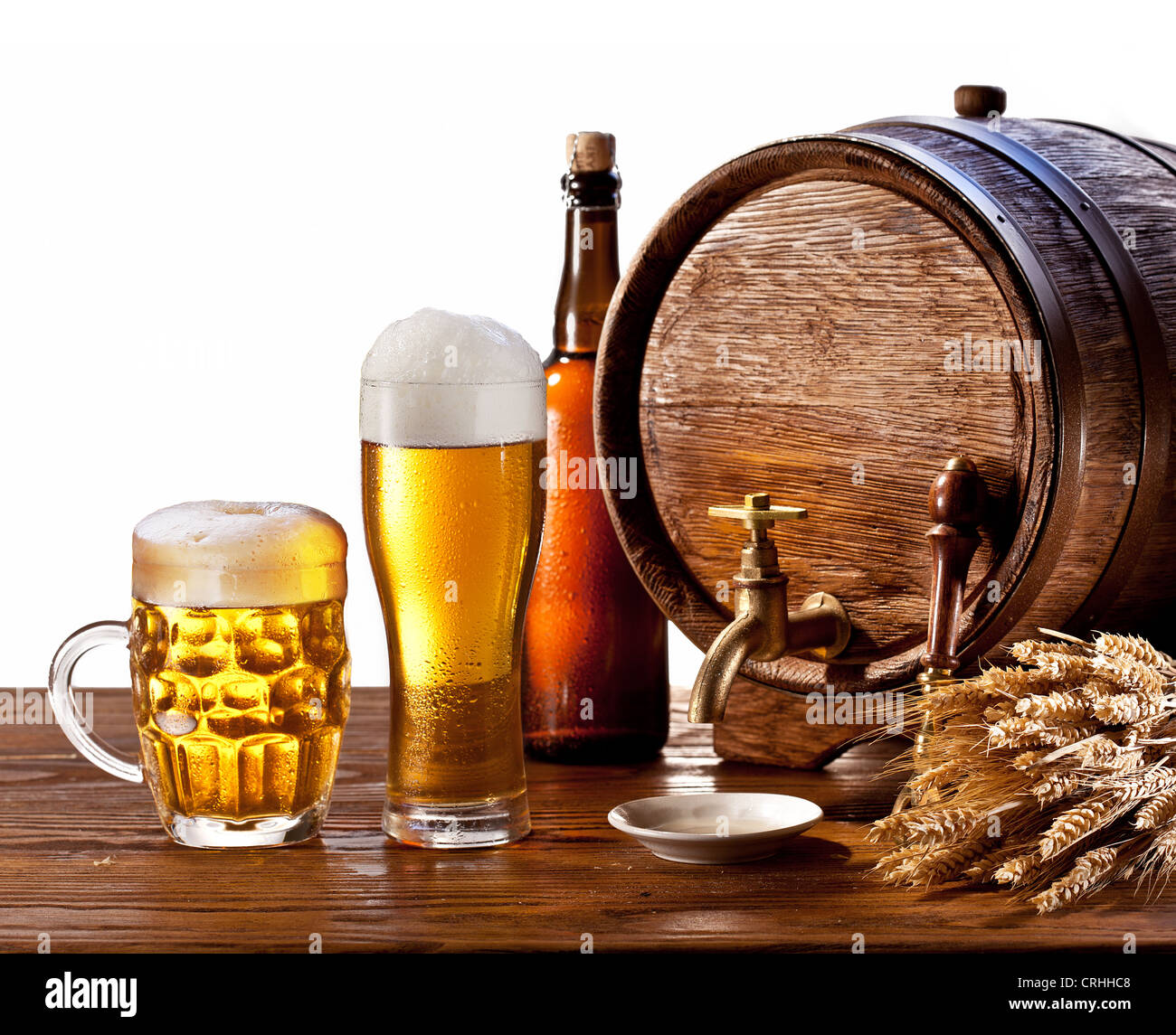 Beer barrel with beer glasses on a wooden table. Isolated on a white background. Stock Photo