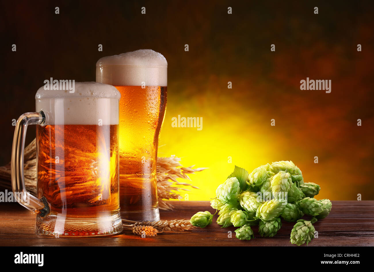 Still life with a keg of beer and hops. Stock Photo