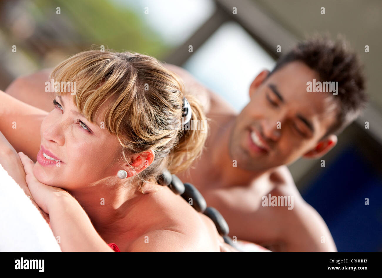 woman getting a hot stone massage Stock Photo