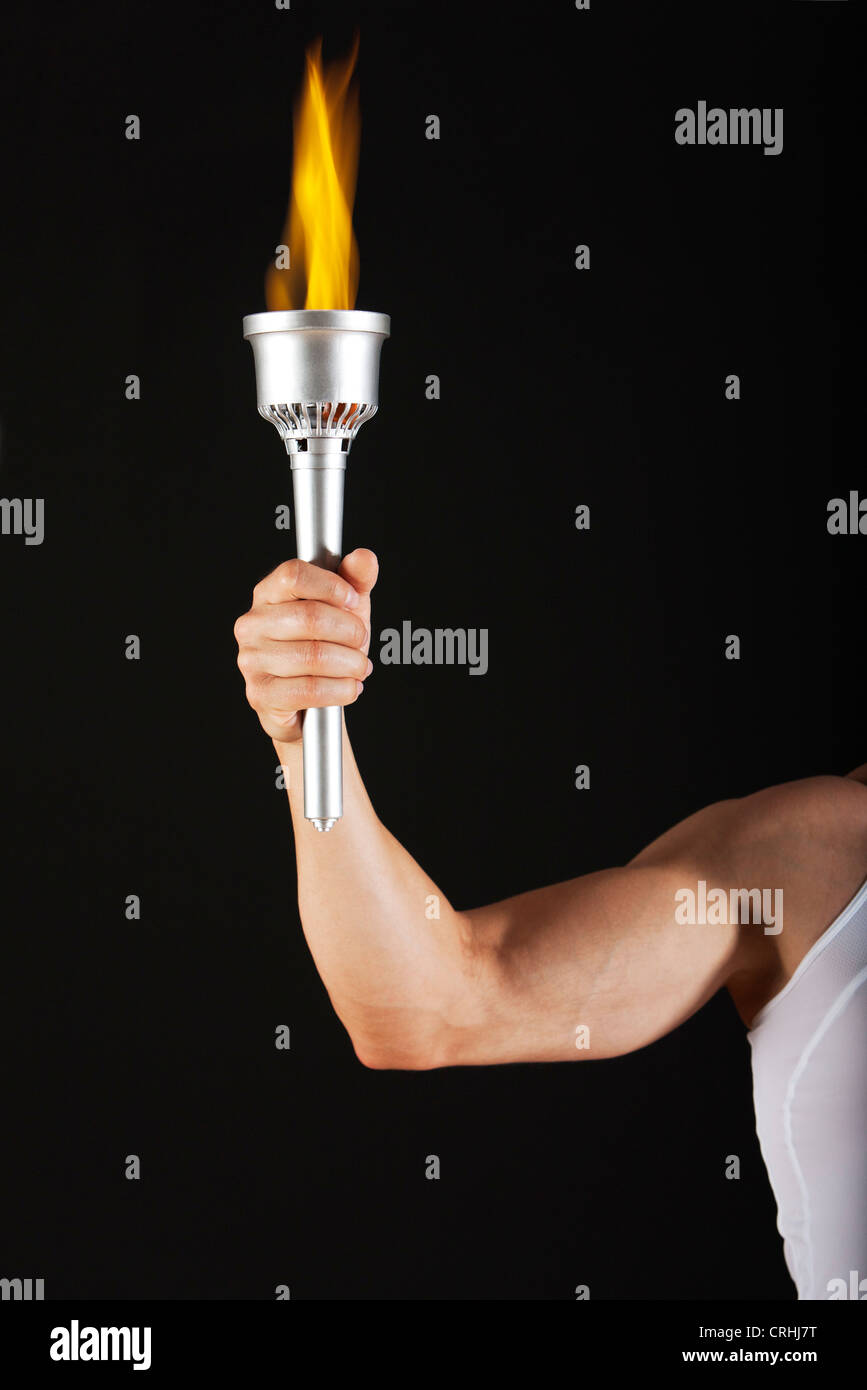 Man holding torch, cropped Stock Photo Alamy