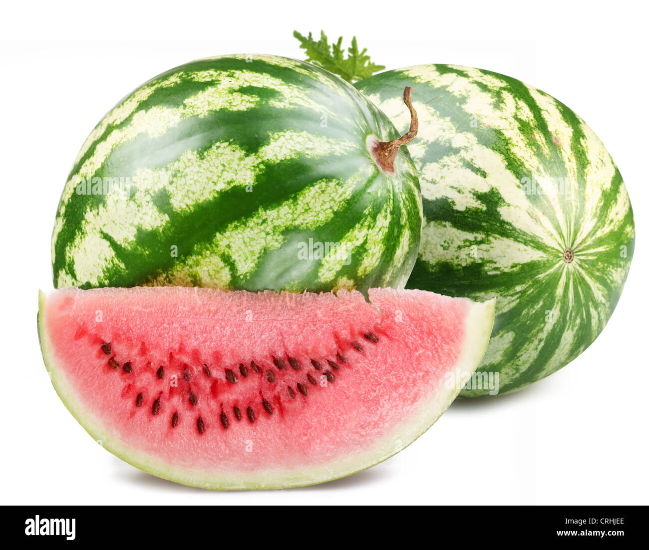 Two watermelon with a slice on a white background. Stock Photo