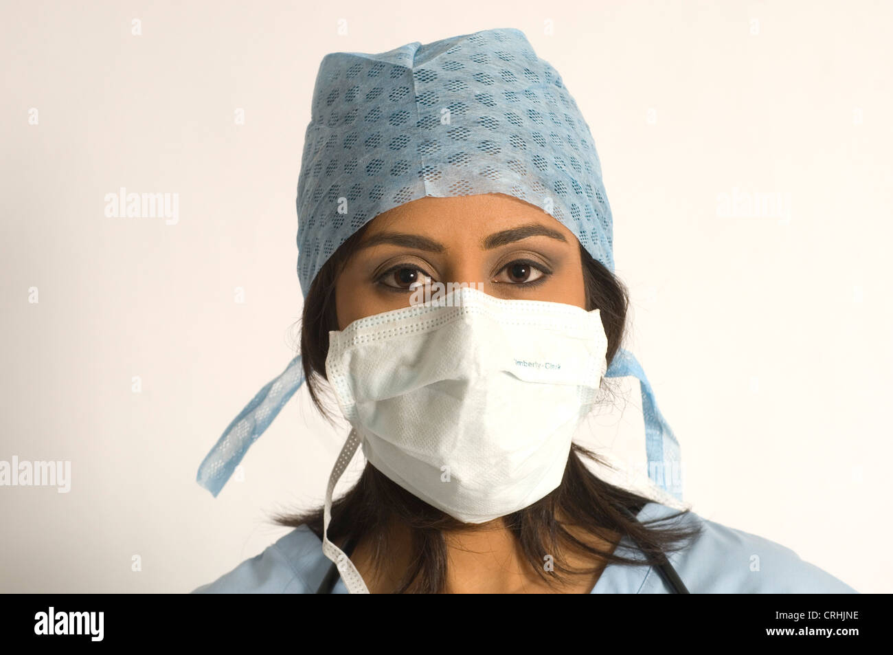 Female surgeon wearing hygiene mask and hat Stock Photo - Alamy