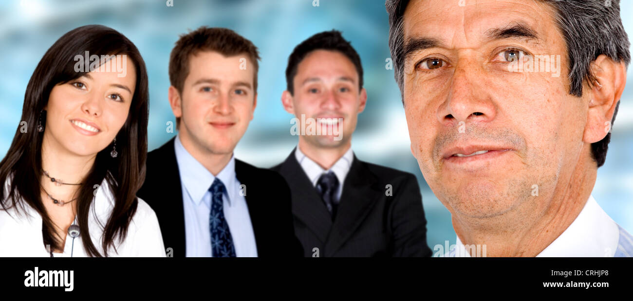 senior businessman in front of his young team Stock Photo