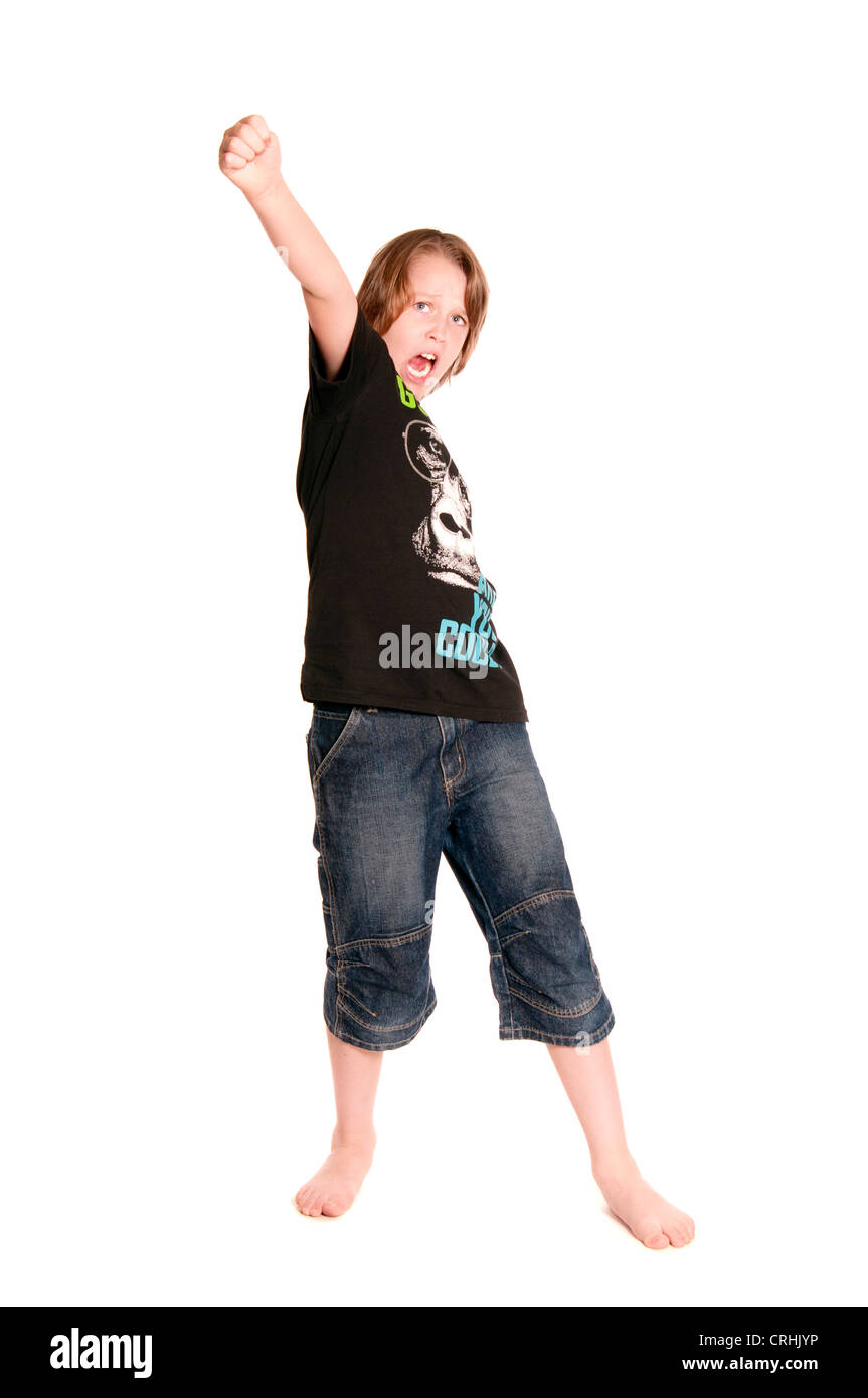 Ten year old boy standing on white background shouting. Stock Photo