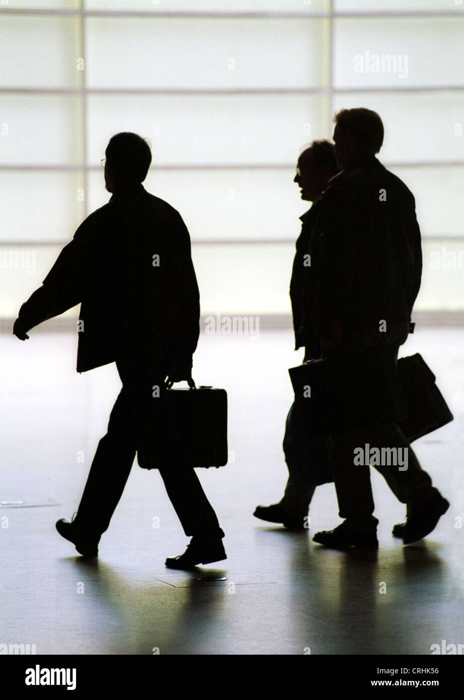 Silhouette of three men with briefcases Stock Photo - Alamy