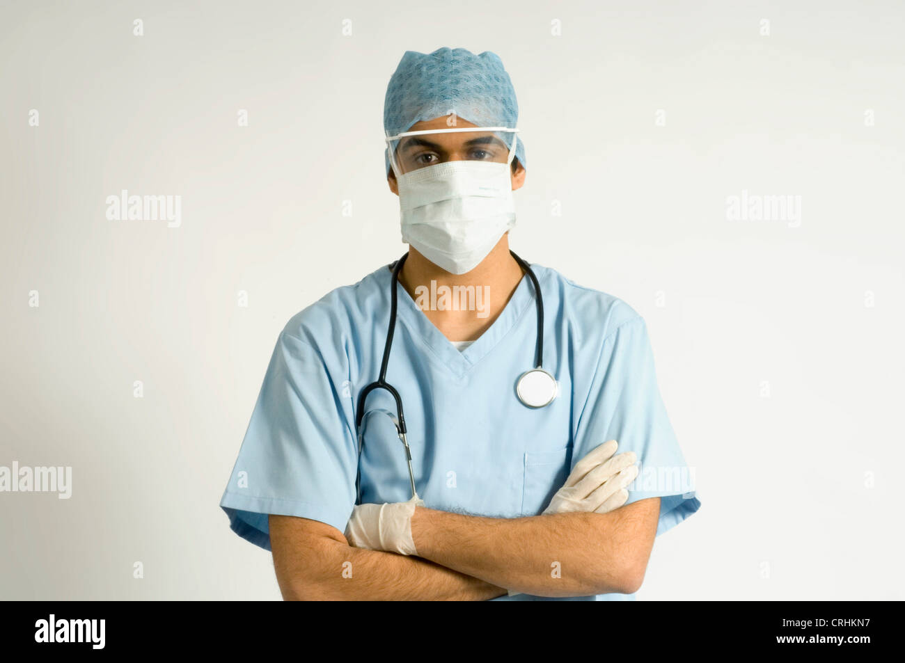 Surgeon wearing protective clothing Stock Photo Alamy