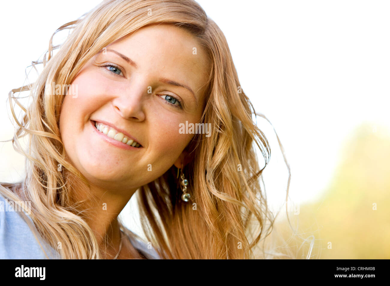 Happy curly haired blonde woman hi-res stock photography and images - Alamy