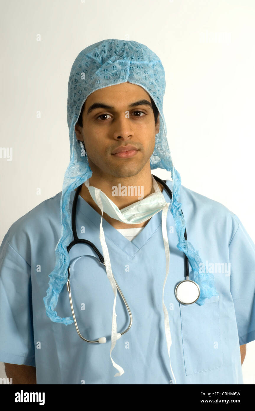 Surgeon wearing protective clothing, including hygiene hat. Stock Photo