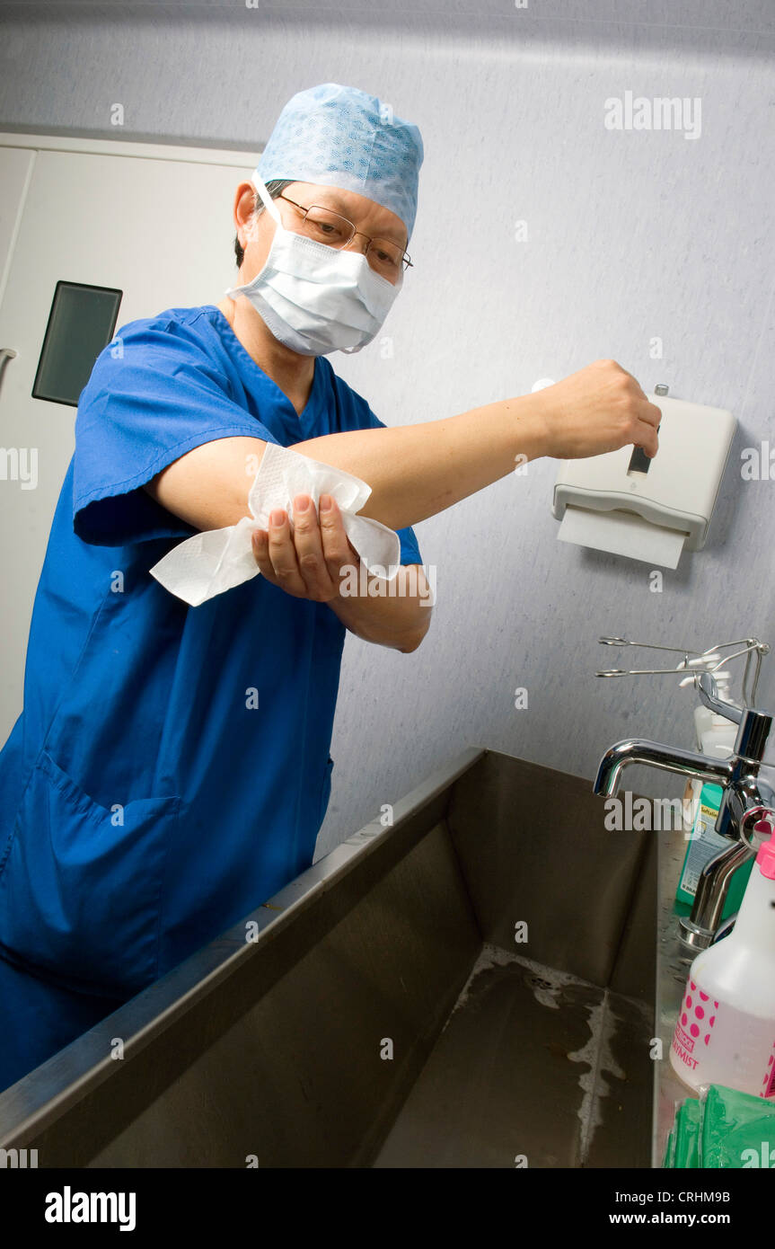 A doctor scrubs his hands as part of procedure before and after surgery