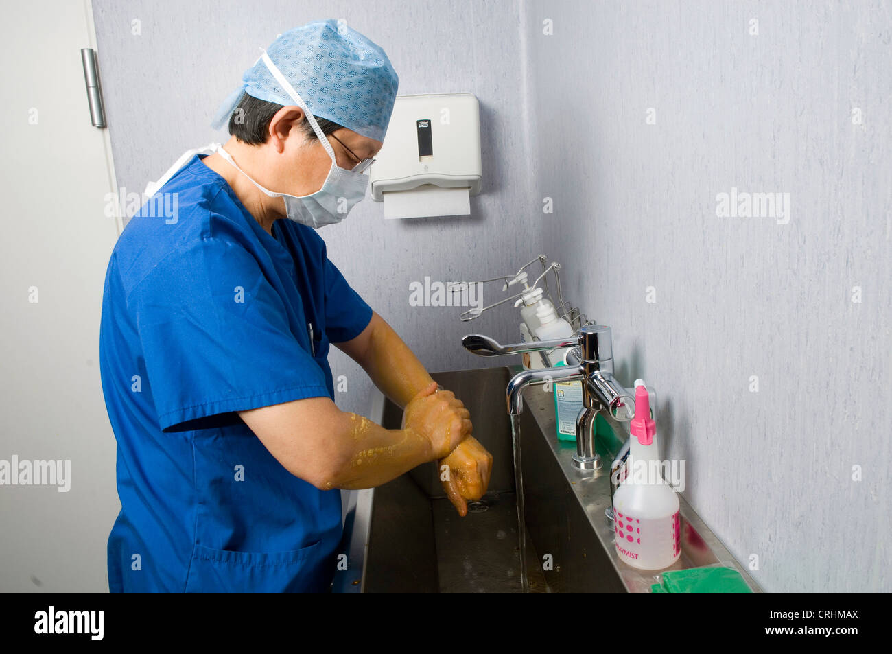 A doctor washes his hands as part of procedure before and after surgery Stock Photo Alamy