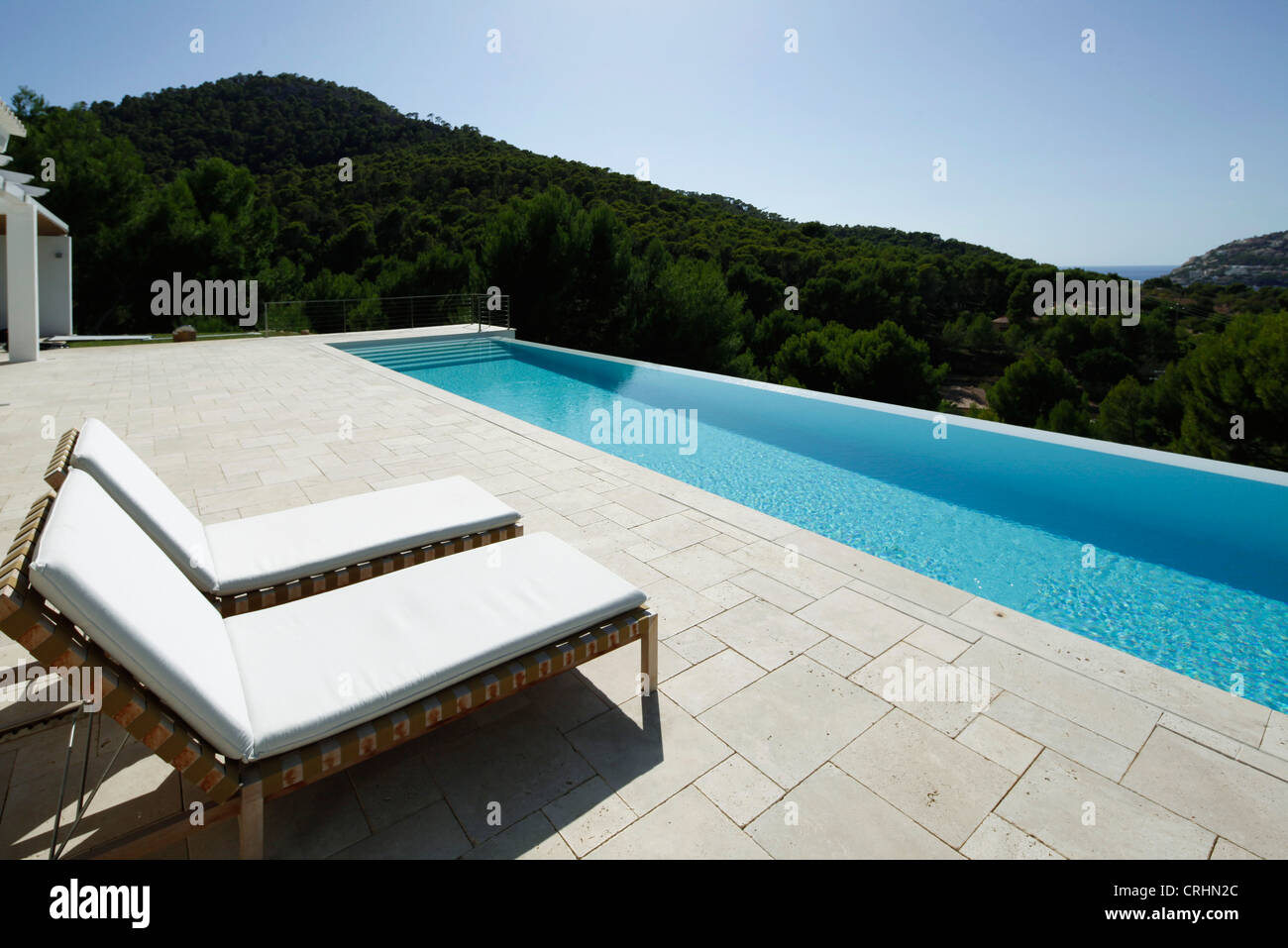 Chairs beside swimming pool sale