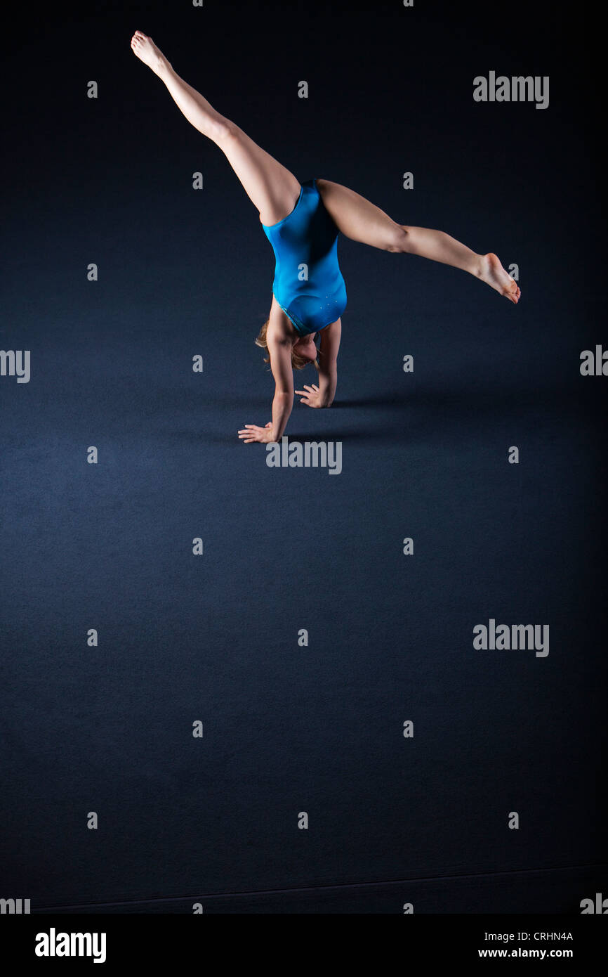Gymnast doing handstand with legs split Stock Photo Alamy