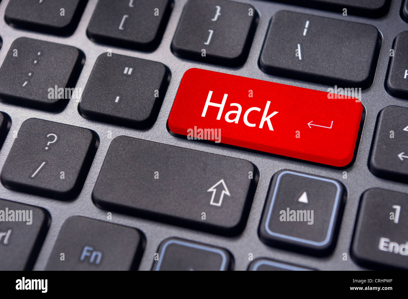 hack concepts of computer security, with a message on keyboard enter key. Stock Photo