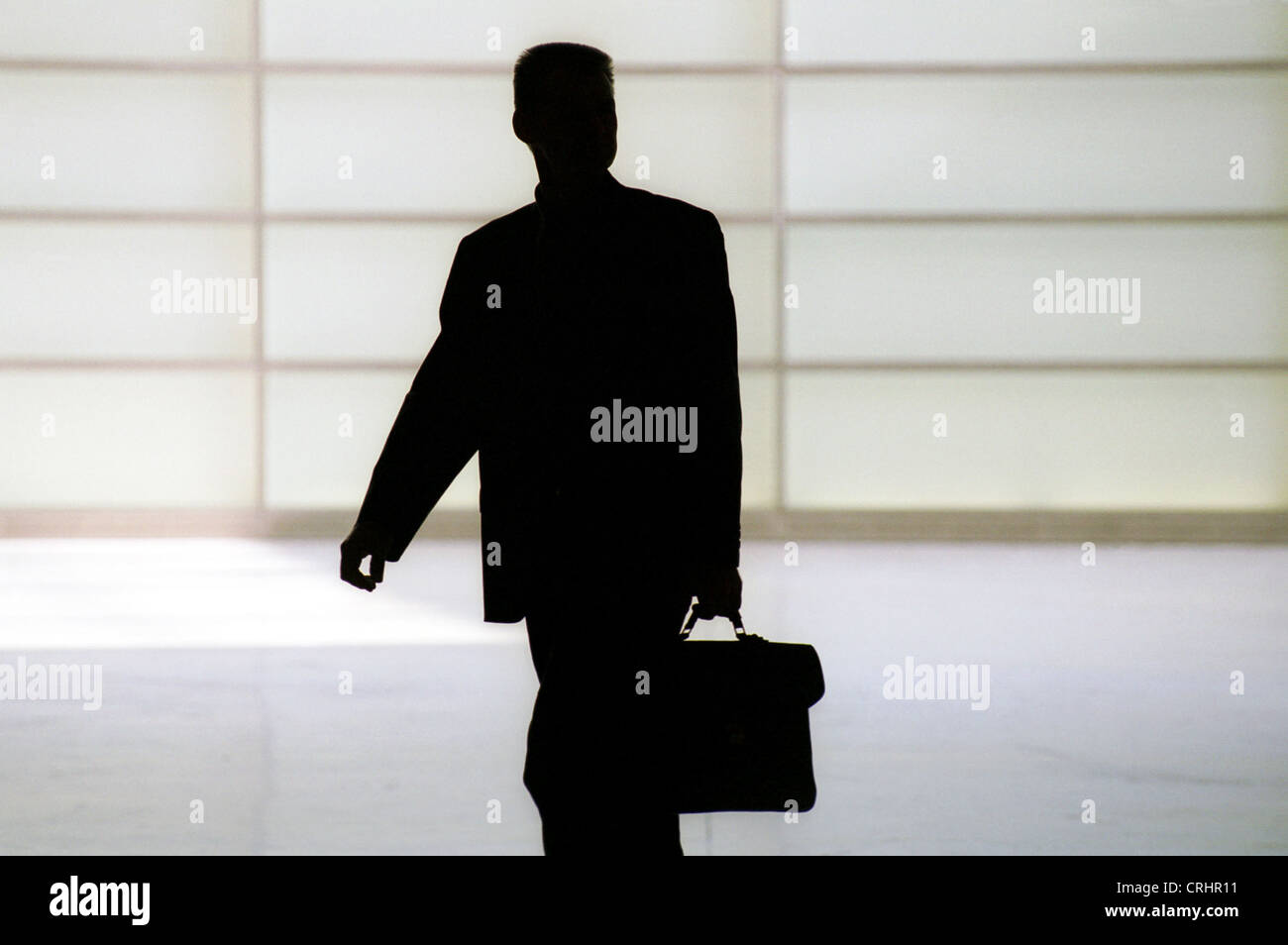Silhouette of a man with a briefcase Stock Photo - Alamy