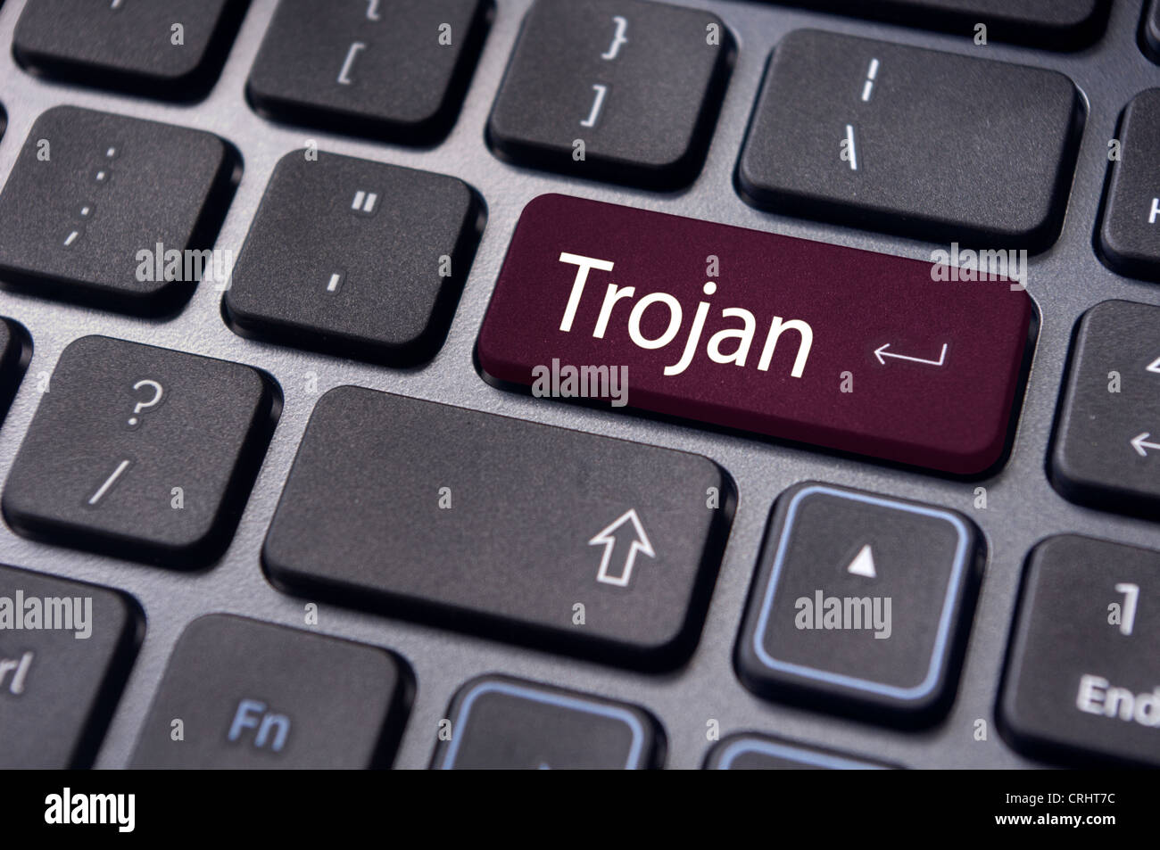 trojan virus for computer, with message on enter key of keyboard. Stock Photo