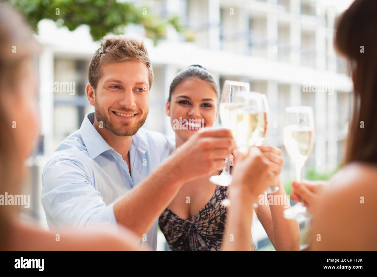 Friends toasting each other Stock Photo