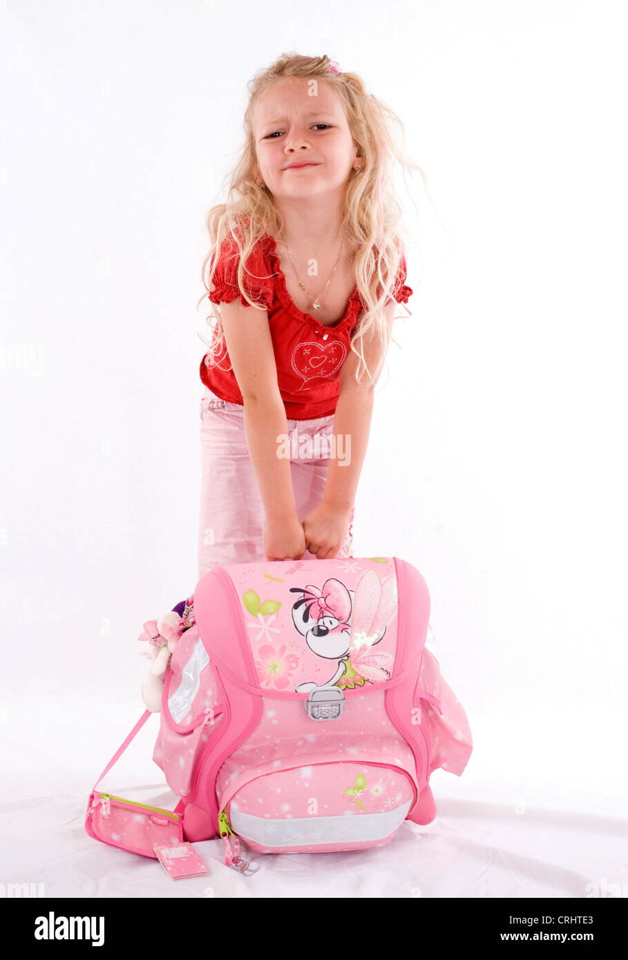 Child carrying heavy school bag hires stock photography and images Alamy