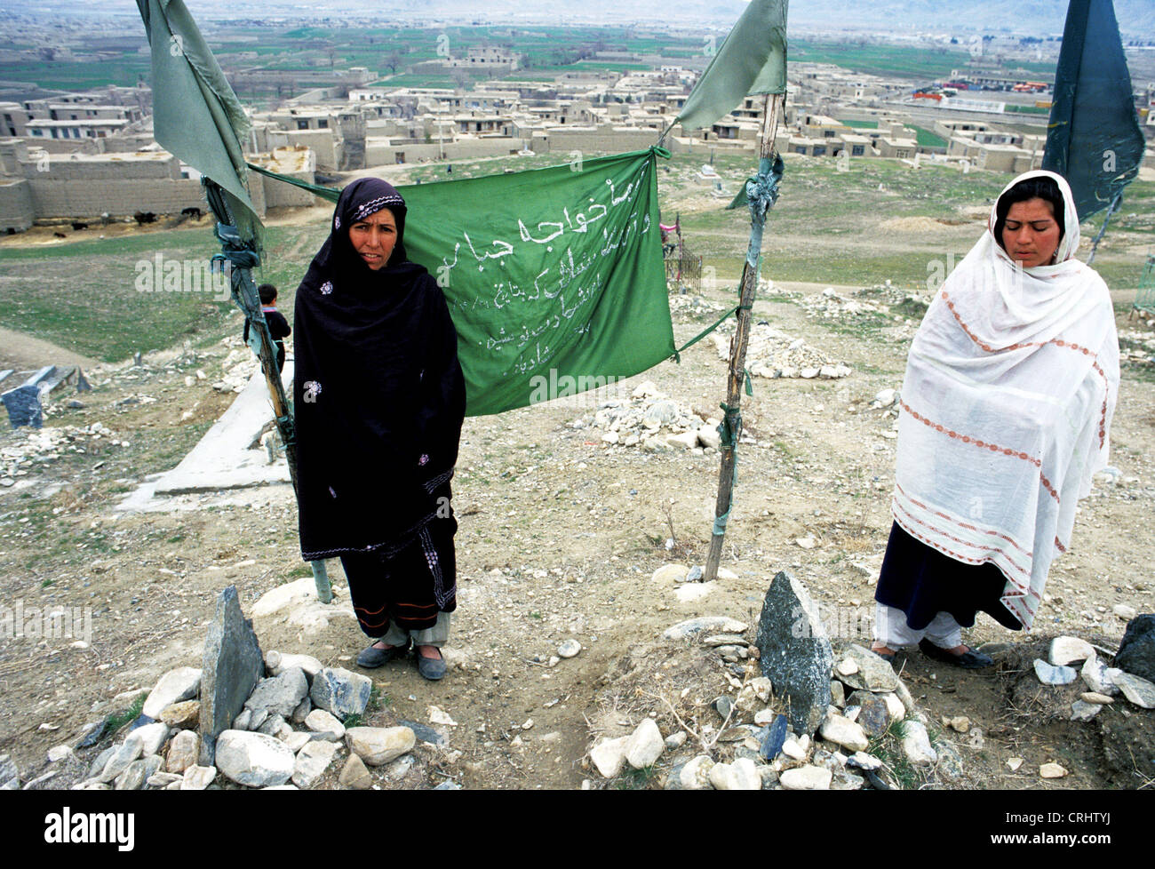 Kabul, Afghanistan, widows in their graves Men Stock Photo