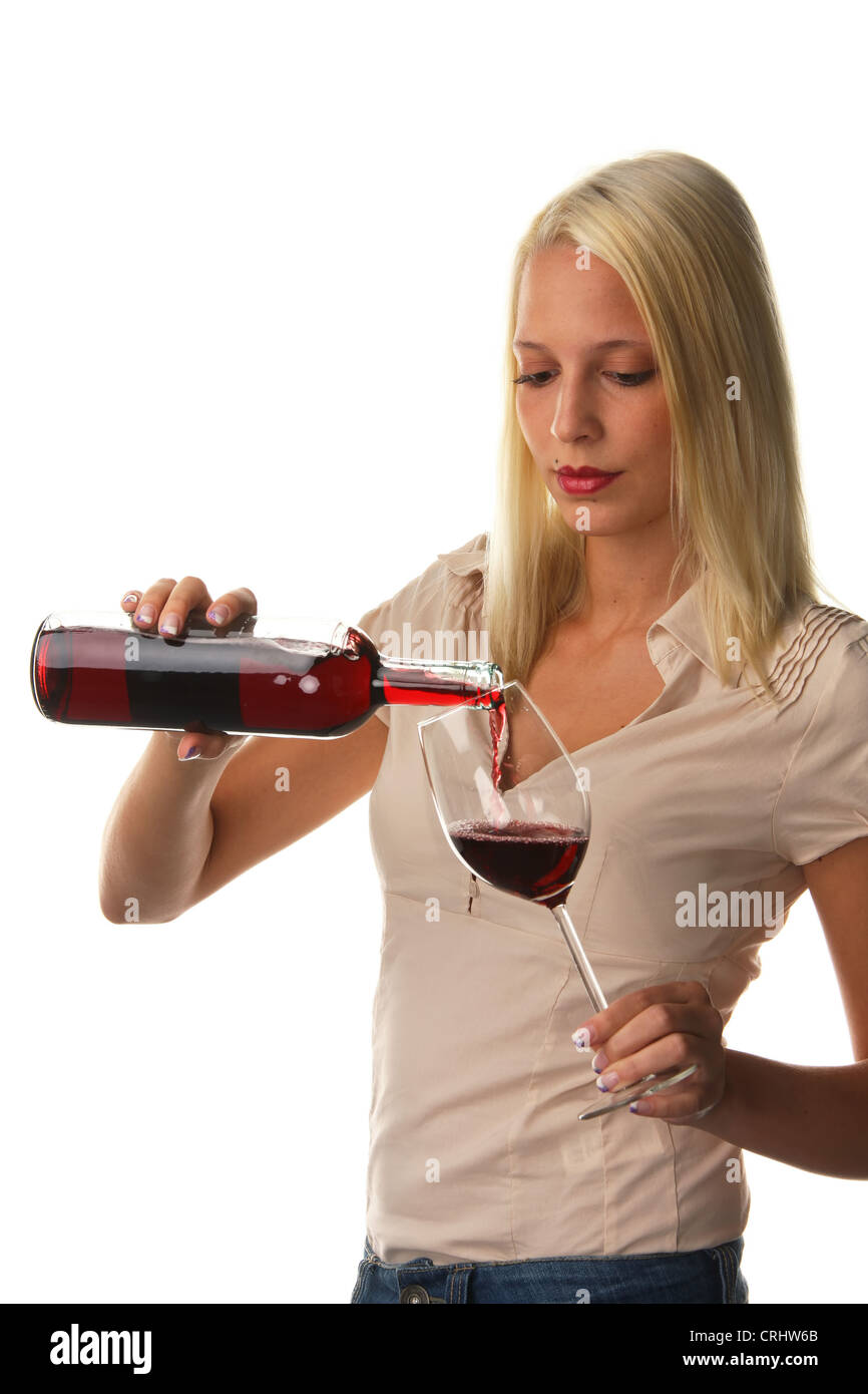 young attractive woman pouring a glass red wine Stock Photo - Alamy