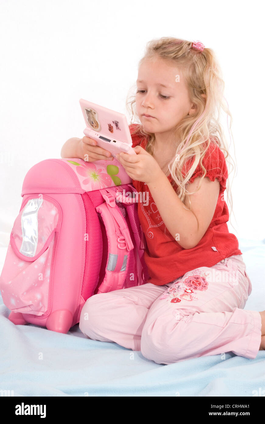 school girl with computer game Stock Photo