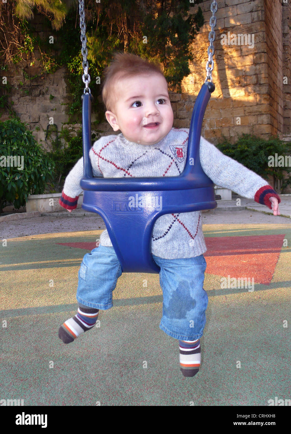 Toddler on a swing hires stock photography and images Alamy