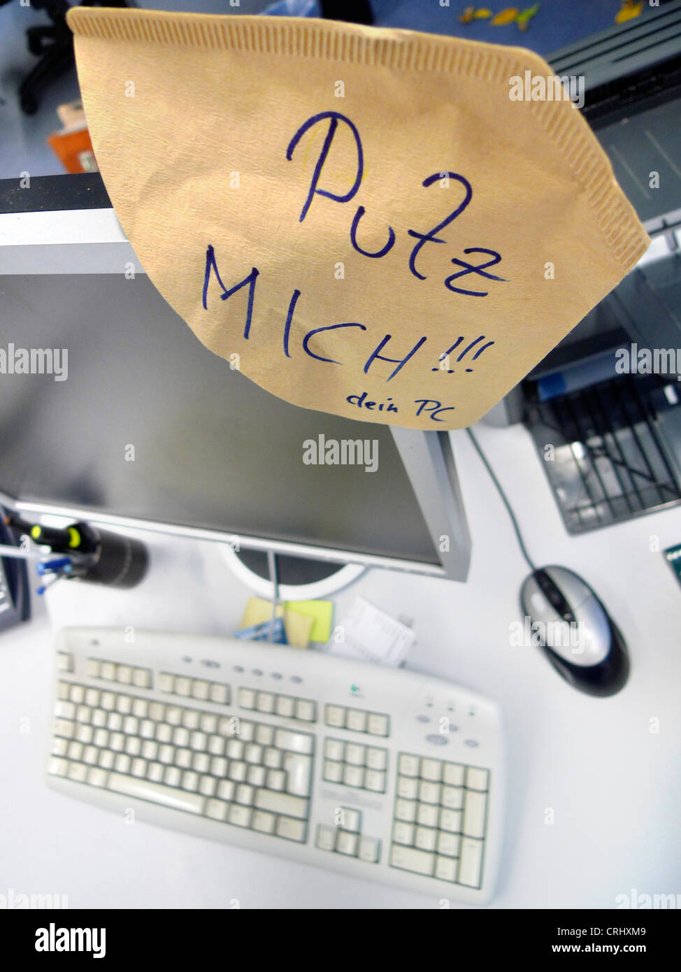 joke by a an office colleague, demand for cleaning the PC, tidy me up! Stock Photo