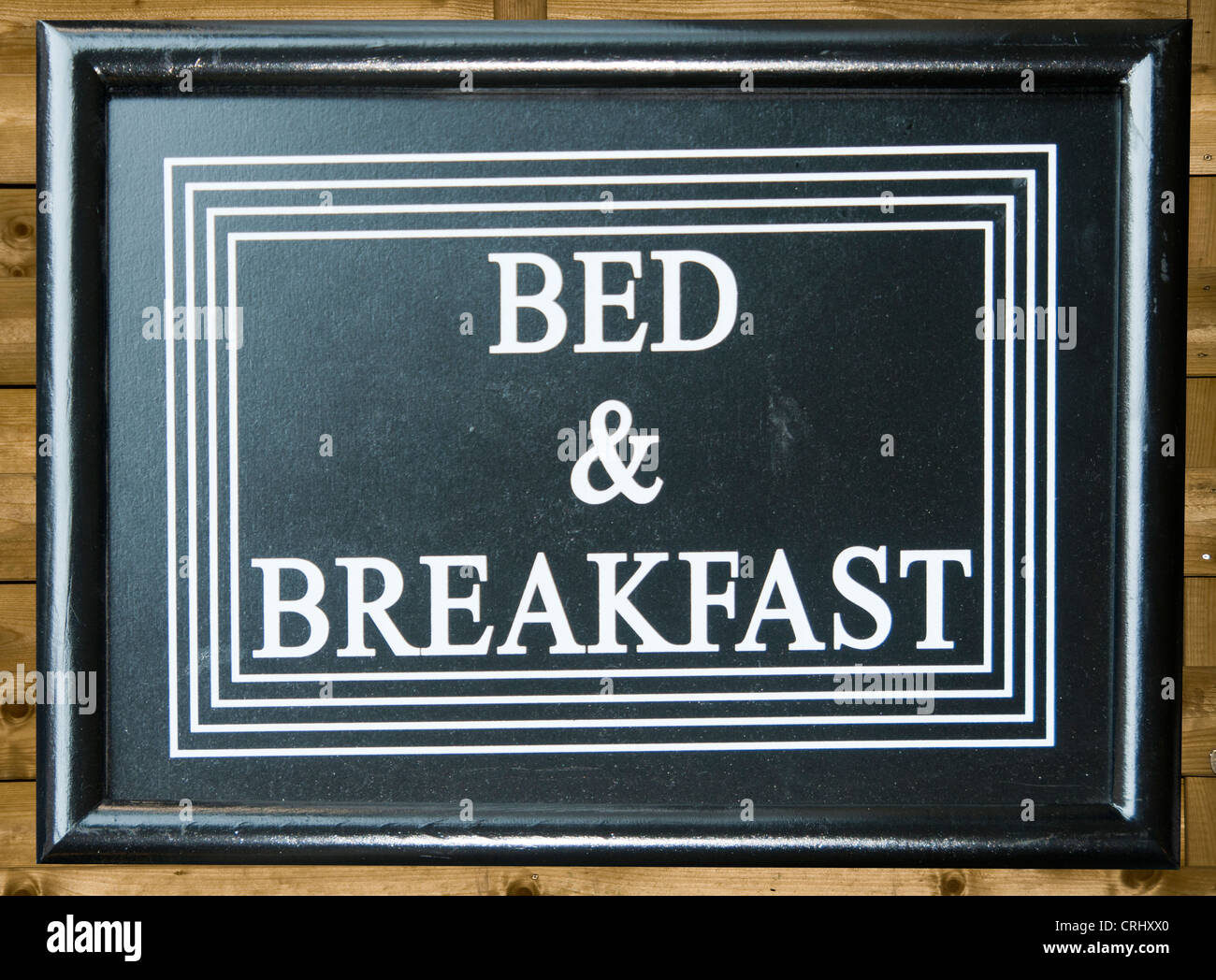 black sign with brown letters bed and breakfast Stock Photo
