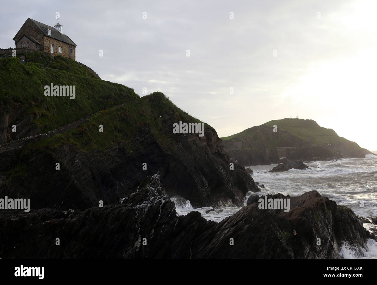 General view of the St Nicholas Chapel on Lantern Hill pictured in Ilfracombe Harbour in Devon, United Kingdom, June 8th, 2012. Stock Photo