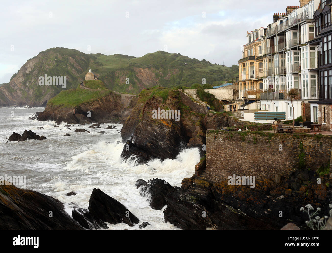 General view of the St Nicholas Chapel on Lantern Hill pictured in Ilfracombe Harbour in Devon, United Kingdom, June 8th, 2012. Stock Photo