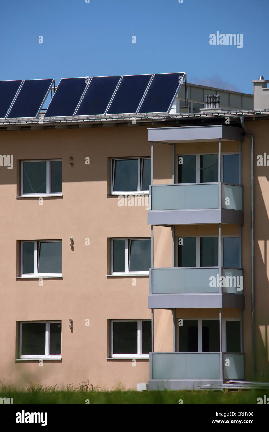 Multi-party house with solar collectors Stock Photo