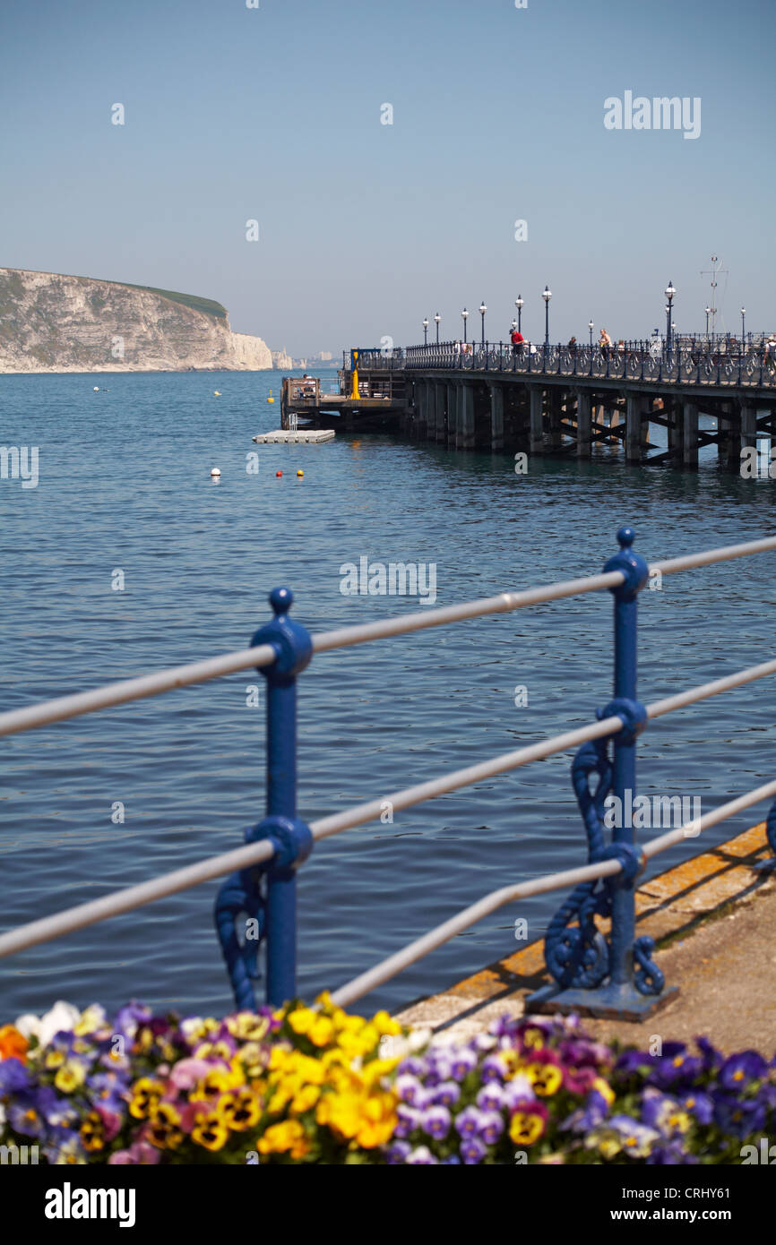 Swanage pier and Dorset coastline with Old Harry Rocks in the distance in May Stock Photo