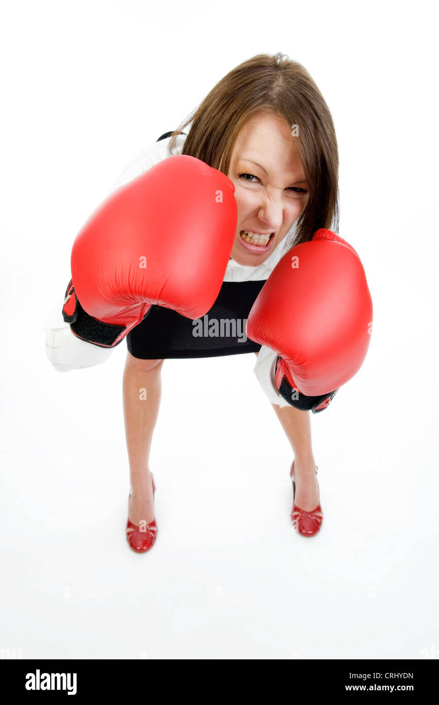 young business woman with boxing gloves Stock Photo