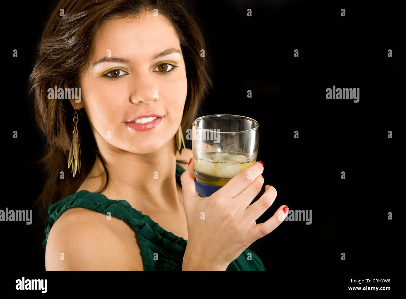 Beautiful elegant woman with a drink in her hand Stock Photo