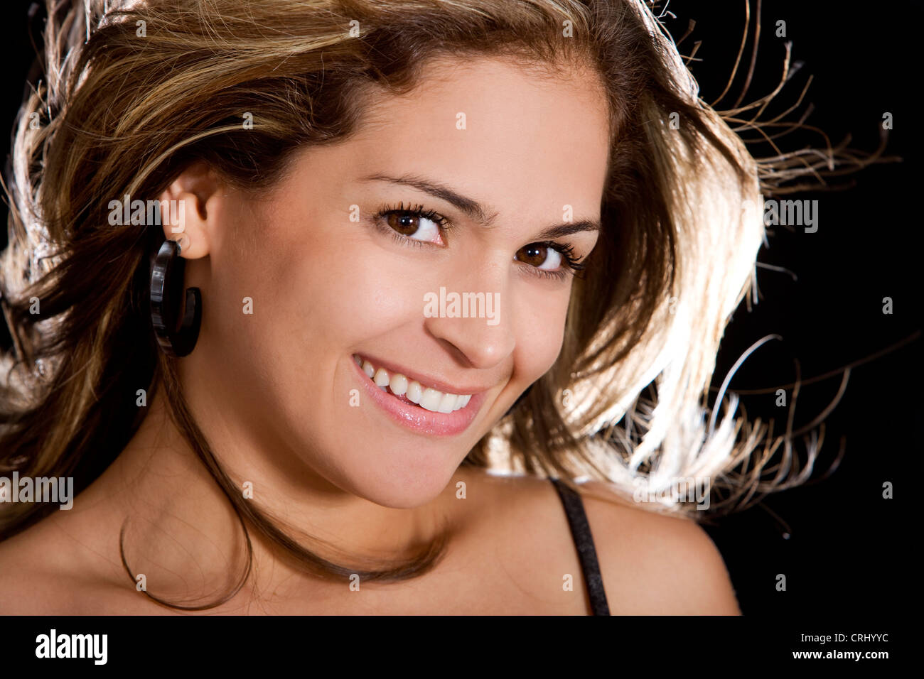 Beautiful woman looking happy  in backlight Stock Photo