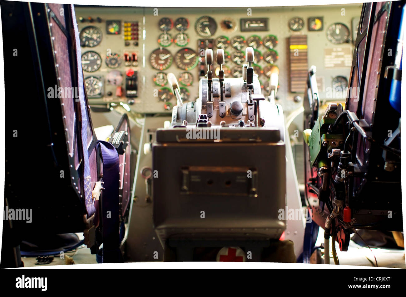 Old Cockpit viewed from behind with pilot and copilot seats Stock Photo