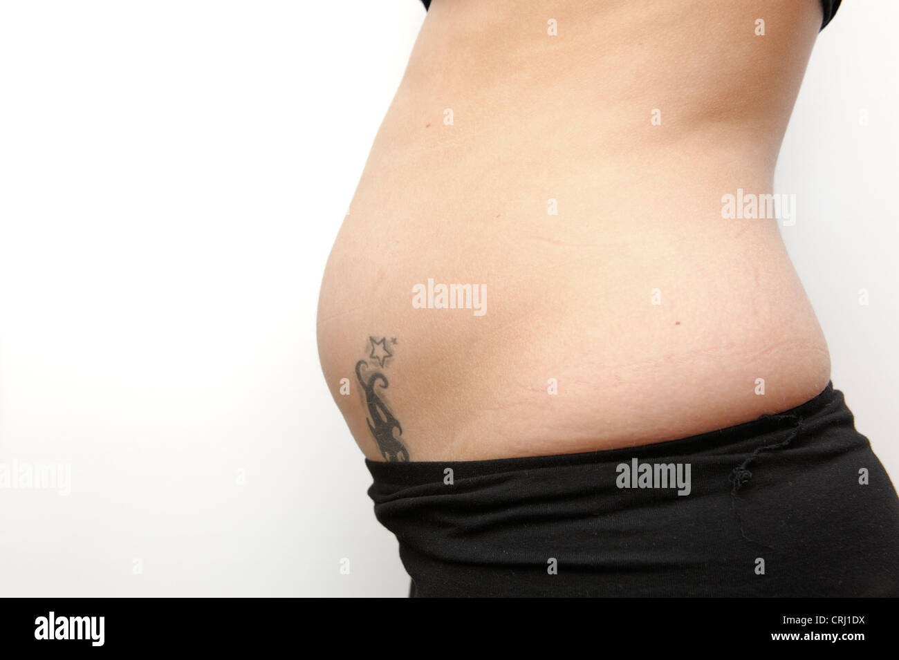 23 year old female 13 weeks pregnant Stock Photo